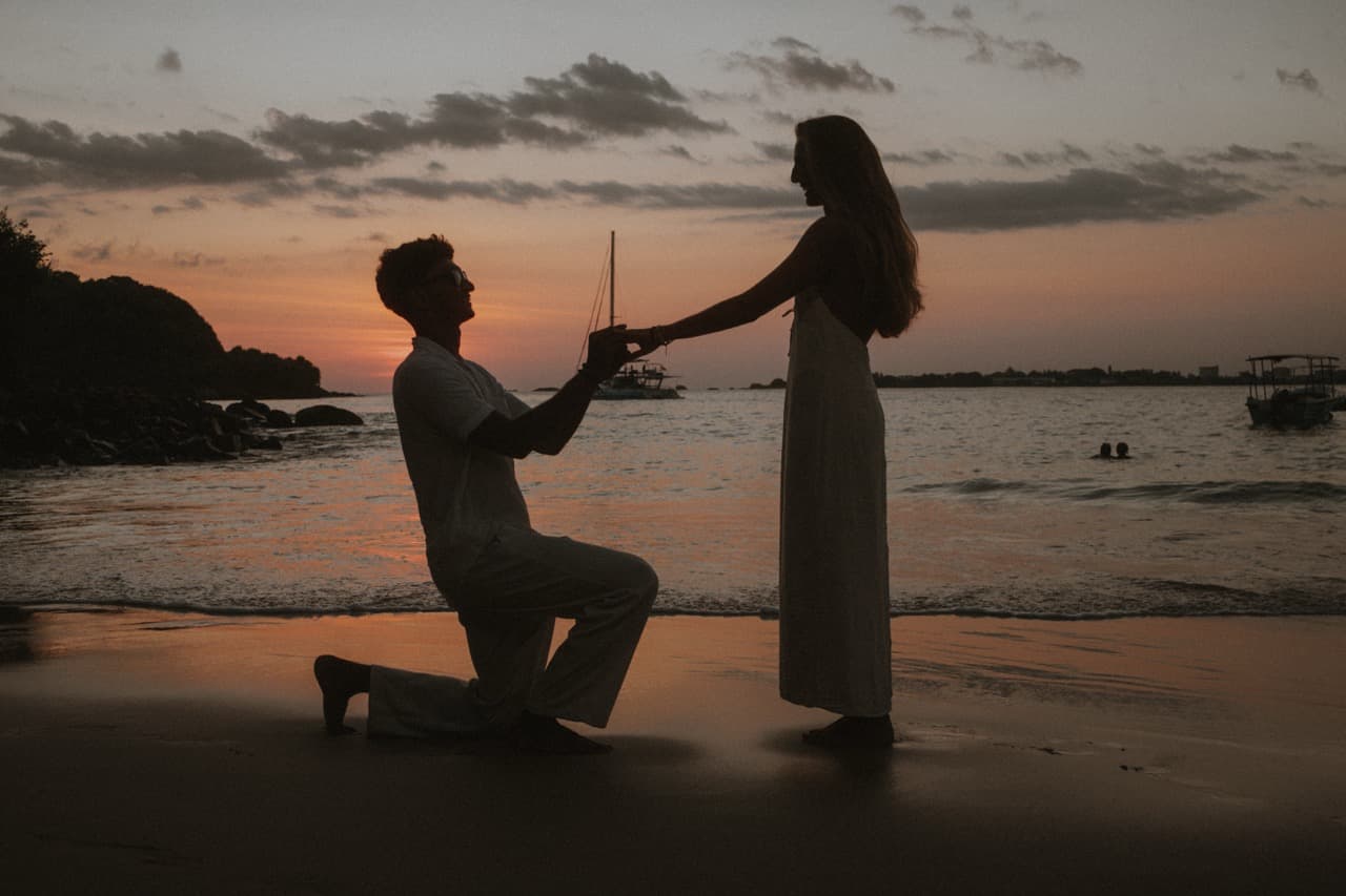 Couple celebrating a wedding ceremony aboard a private yacht
