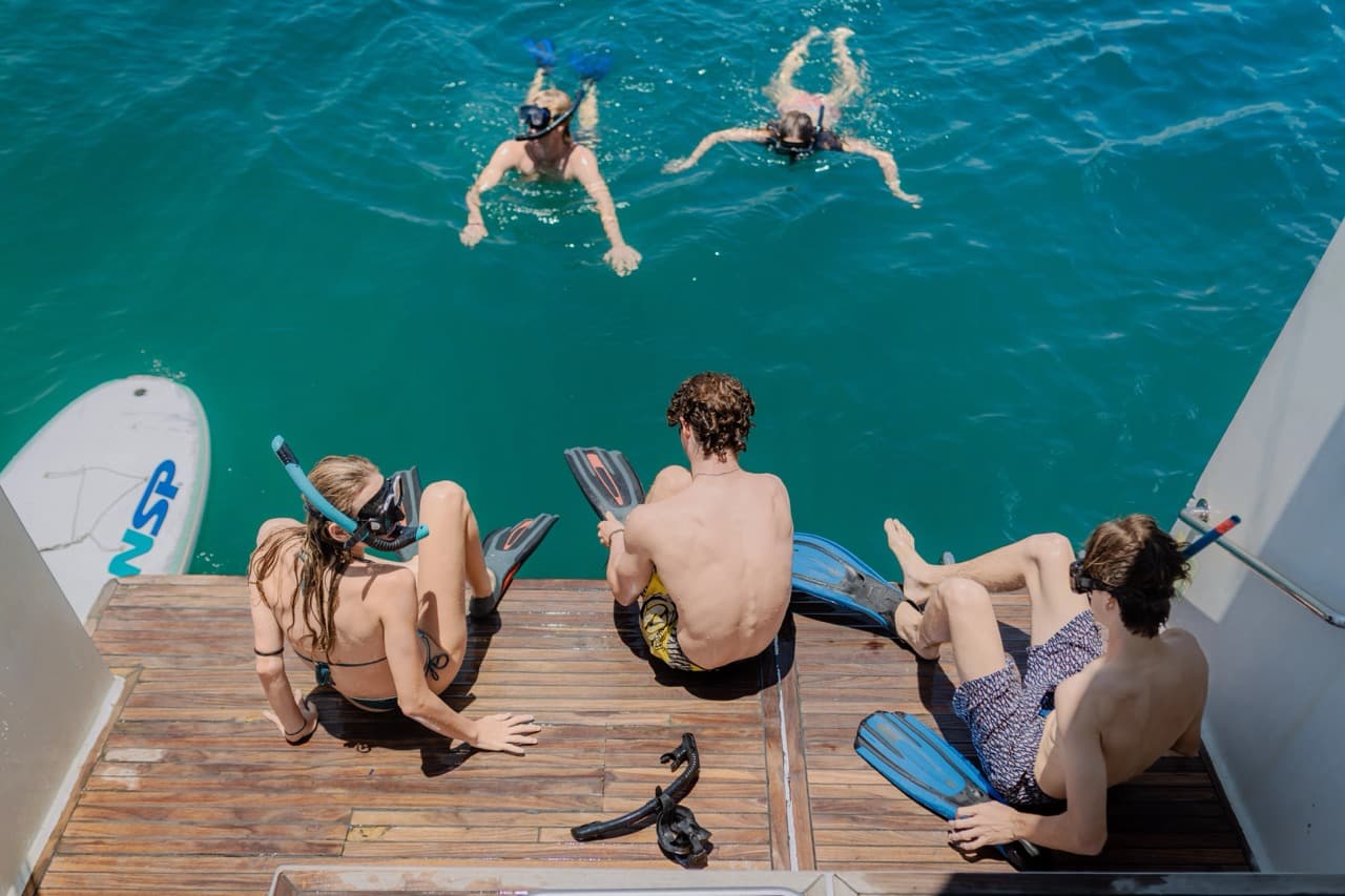 Friends relaxing together on a private yacht charter
