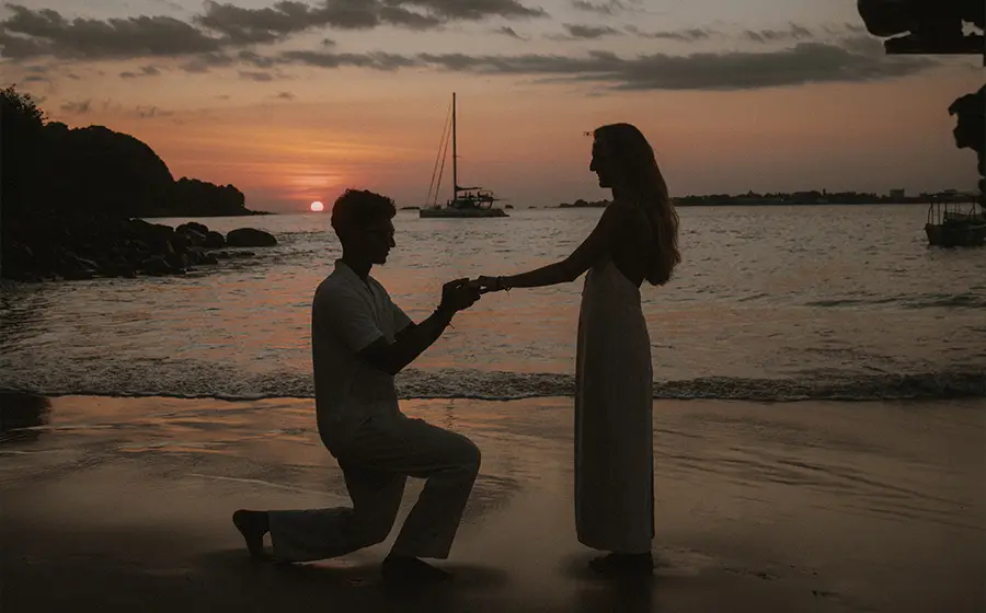 Couple celebrating a wedding ceremony aboard a private yacht