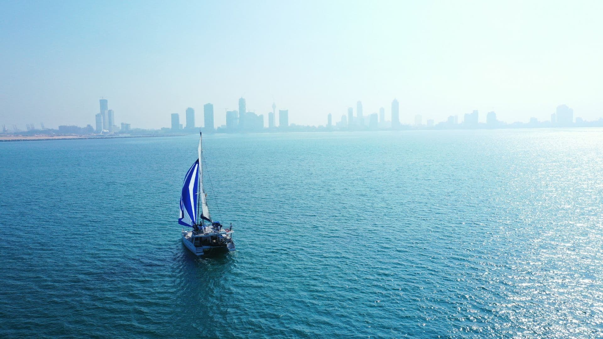 Sail Lanka catamaran at anchor in a calm bay, Sri Lanka