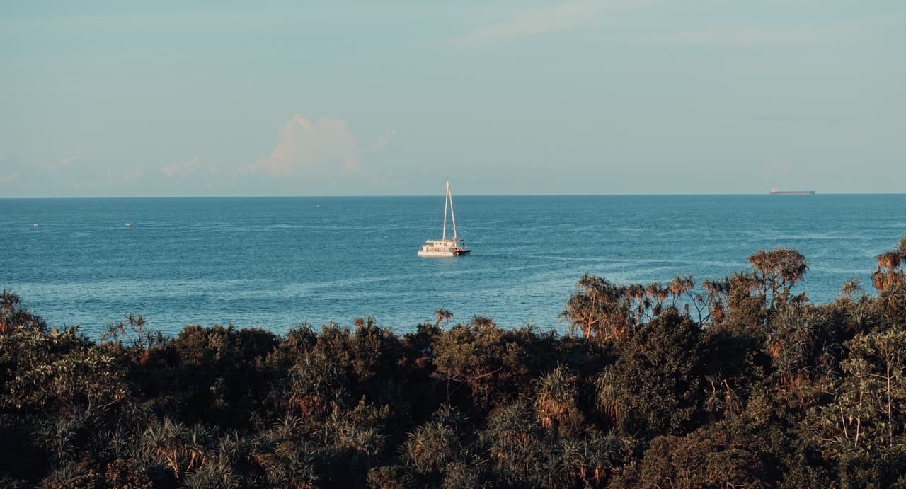 Sail Lanka catamaran at anchor in a sheltered Sri Lankan bay